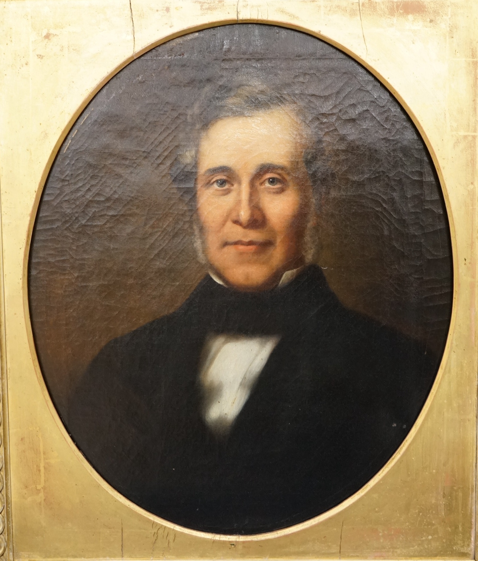 Mid 19th century, English School, feigned oval oil on canvas, Portrait of a gentleman, unsigned, 58 x 48cm, gilt framed. Condition - fair to good